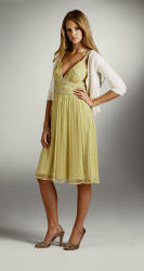 The yellow lemon beade dress �120 from French Connection is Grecian in line and has that same soft feminine charge.  It's teamed with acream cardigan �55 and gold shoes �75.